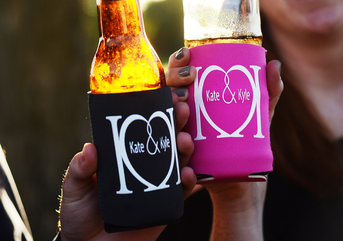 Guests holding koozies on drinks